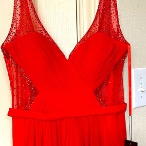 Elegant red dress with hand stitched beads.